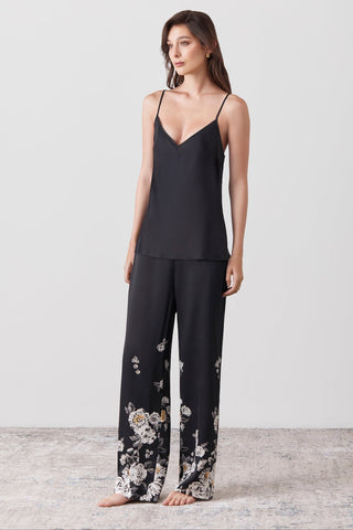 Woman wearing a silk top v neck and long silk pants printed by hand