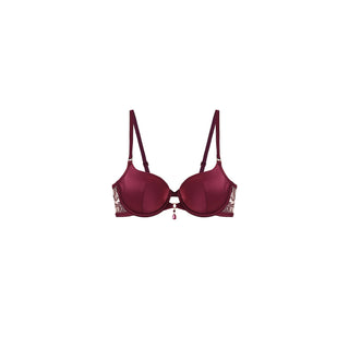 A structured underwire bra in deep burgundy with decorative gold lace detailing on the outer cups and a small dangling charm at the center, shown against a plain white background.